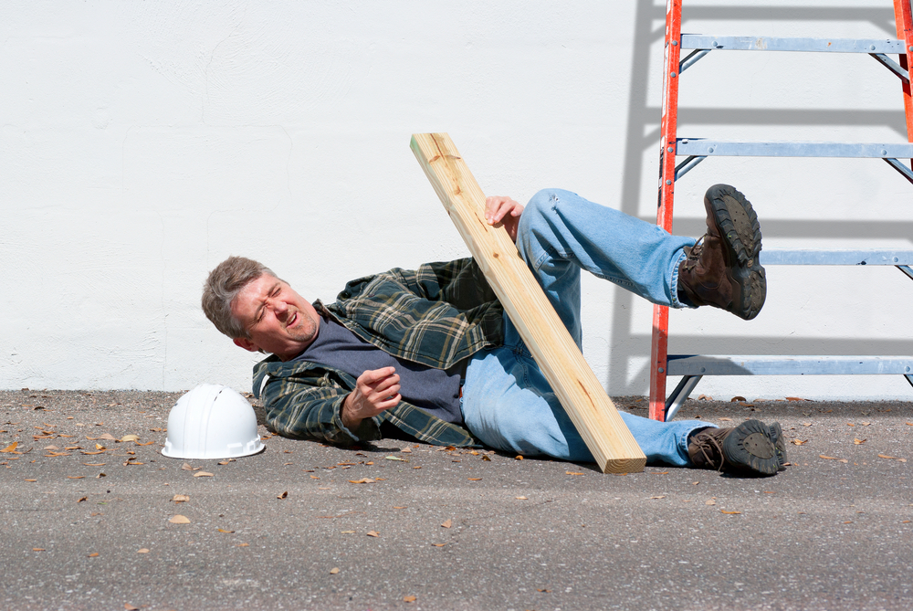 injured construction worker who just fell from a ladder on a construction job