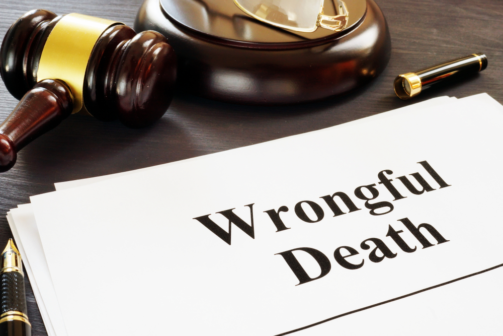 wrongful death report and gavel in a court